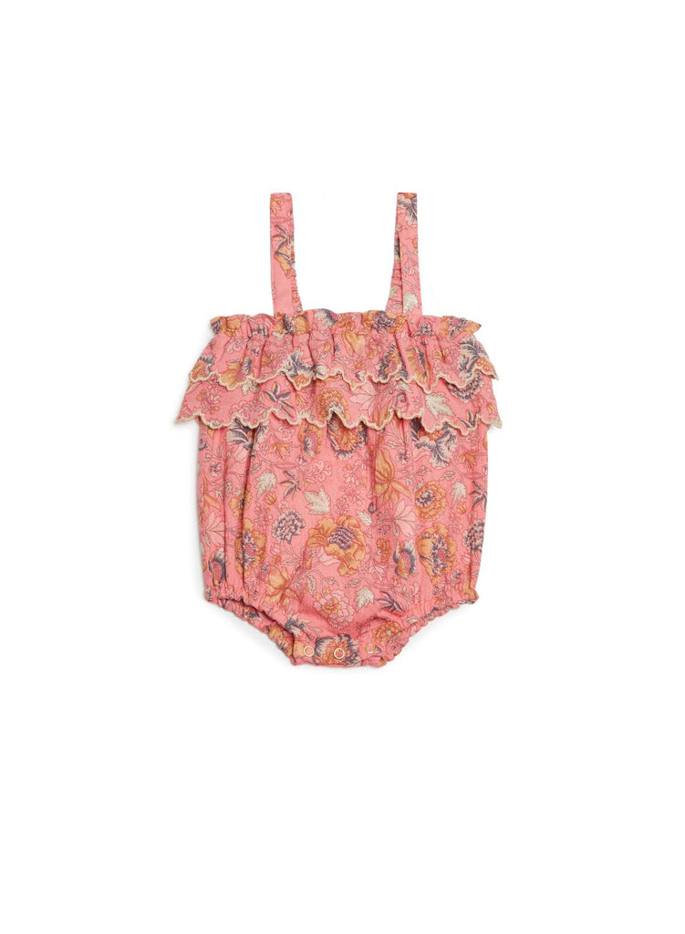 A floral pink baby girl summer romper is the most adorable outfit this summer. The organic cotton baby romper is breathable and made with lightweight organic cotton. Baby girl pink romper is made with breathable organic cotton in a bohemian strawberry print by Louise Misha. The breathable organic cotton girl's pink romper is girly, comfortable, and stylish to make the little princess look even more adorable.