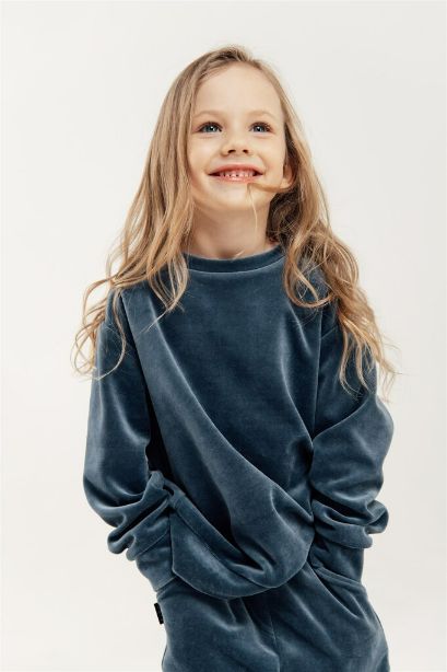 The velvet kid's sweatshirt will make you feel trendy and very comfortable during cooler days. Perfect for casual days out or lounging at home. Made with cotton without harmful chemicals involved in production in fair trade in Latvia.  The velvet kid's sweatshirt is a unisex style and in the perfect color to keep the stains away. Mommy and Me styles are available for Mini Me matching, Mommy and daughter and Mommy and Son styles.