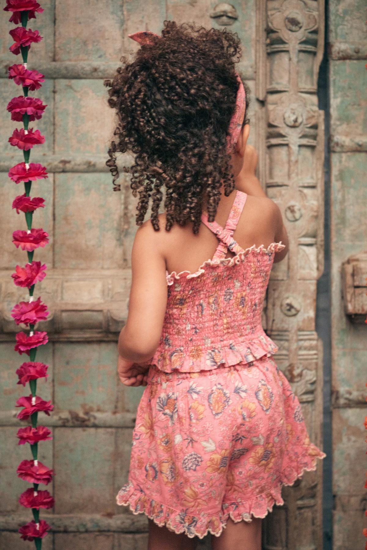 Pink organic cotton cropped girl's top is breathable and lightweight by Louise Misha. MiliMilu offers sustainable kids clothing & organic cotton baby clothing.
