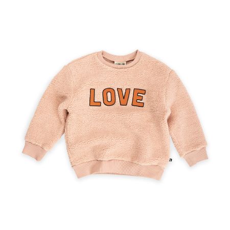 The extra soft and warm teddy jumper is a must-have for every girl's wardrobe, comfortable and soft for everyday wear. The sweater is in pink colour with big LOVE wording on the front and a round neck, made by CarlijnQ. We are in LOVE with this sweater! This sweater is really warm and soft to wear because of the teddy fabric. The softest and cuddliest jumpers for every girl.