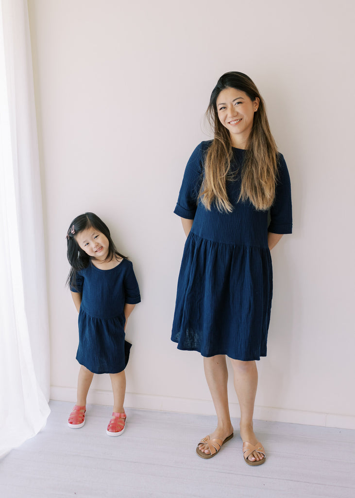 Beautifully handcraft our Back to Nature navy girls dress with 3/4 sleeves for cooler weather from organic cotton to bring you closer to nature with the freedom it gives you. This product is made of 100% organic cotton (GOTS).  This sustainable girls' dress is comfortable and soft. Mommy and Me styles are available.