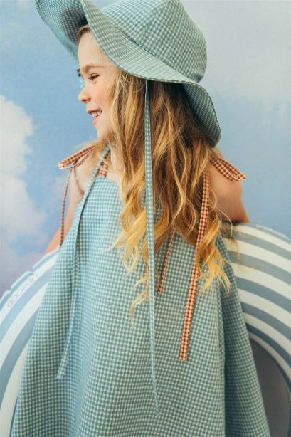 The light Mint Checkered summer hat for kids with straps. Mint kid's hat is made with lightweight and breathable organic cotton (GOTS) in green-blue checkered.