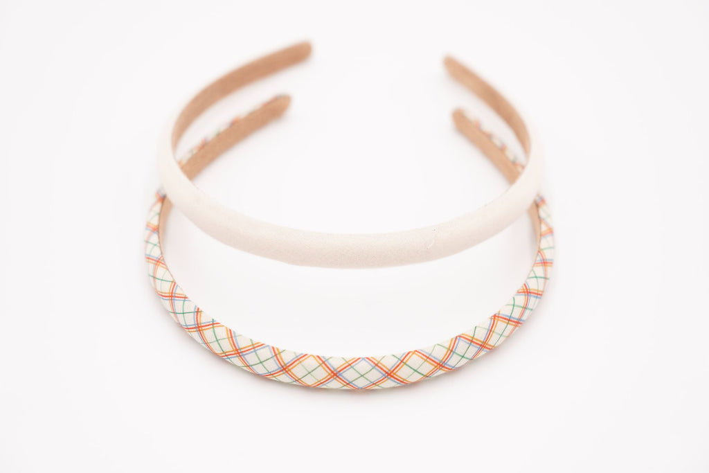 Two headbands are made with organic cotton. They feature a fun combination of plaid patterns made by Grech&Co. They are perfect headbands for stay-at-home days, styled-up hair days, messy hair days, and all the days in between. They are light, stylish, and fun and made from organic cotton, kind to our hair and nature.