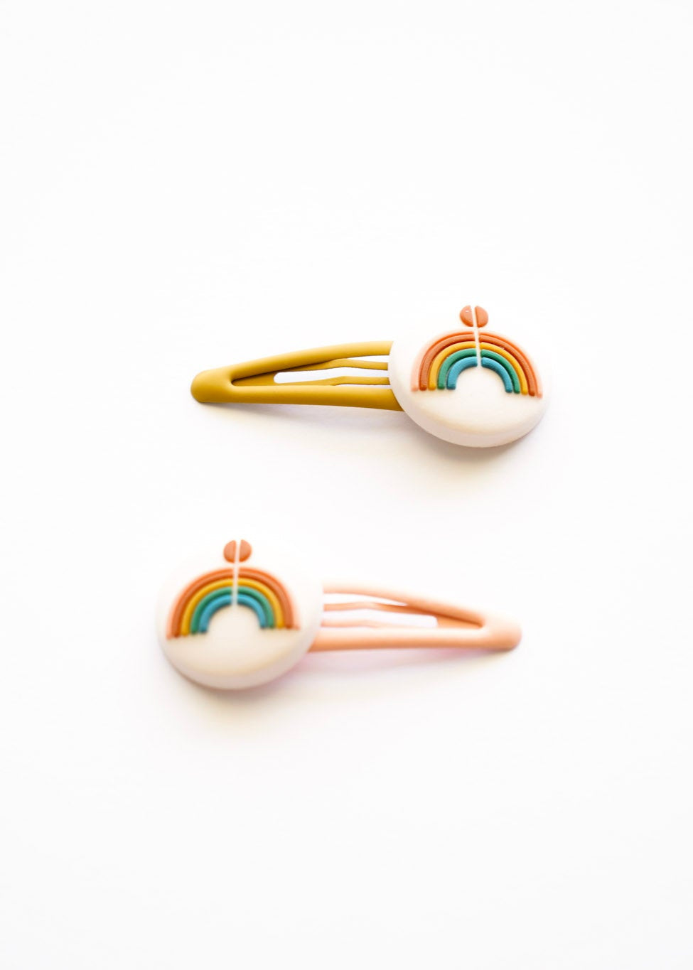 Grech & Co rainbow snap clips set of 2 in mustard and blush with boho terracotta teal rainbow motif on white background — sustainable girls hair accessories at Milimilu