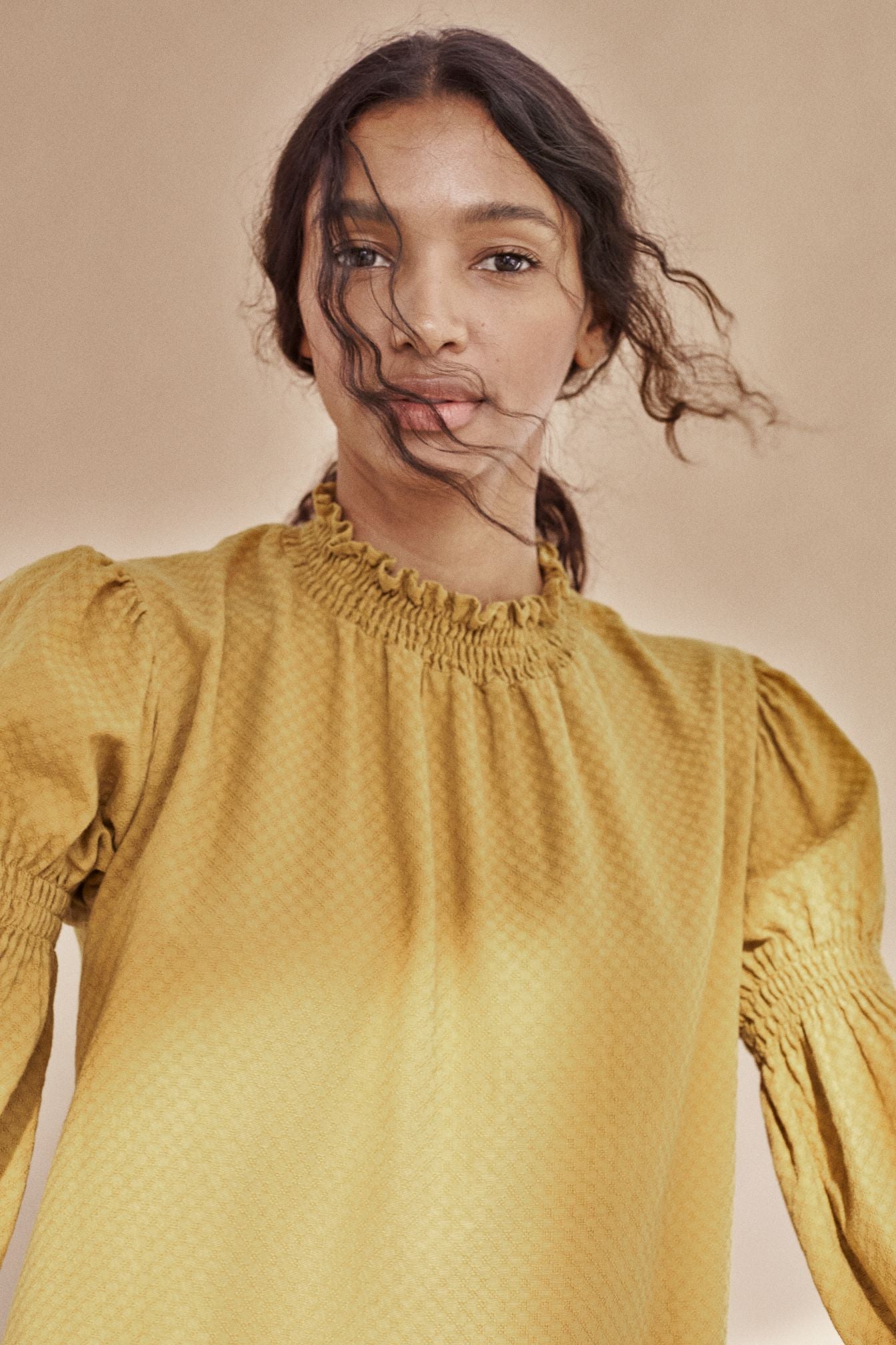 Breathable organic cotton women blouse is with a high neck made with organiccotton in mustard colour. Shop sustainable women fashion at MiliMilu Lifestyle.