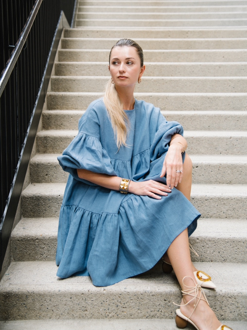Slow fashion women's linen dress in french blue color with long voluminous sleeves made from pure linen. Timeless women's dress for capsule wardrobe.