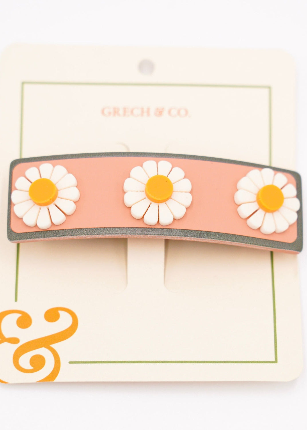 Girl wearing Grech & Co pink flower wide bar clip eco-friendly cellulose acetate hair accessory