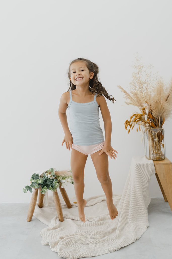 Just Peachy Camisoles are super soft and gentle on your little ones' skin. Designed with a snug fit for play, movement and a comfy night's rest. Add the breathable Camisole layer under your day clothes or snooze in maximum comfort. Made with Lenzing® TENCEL™ Micro Modal Fibers. Kids' underwear for sensitive skin, the best kids underwear.