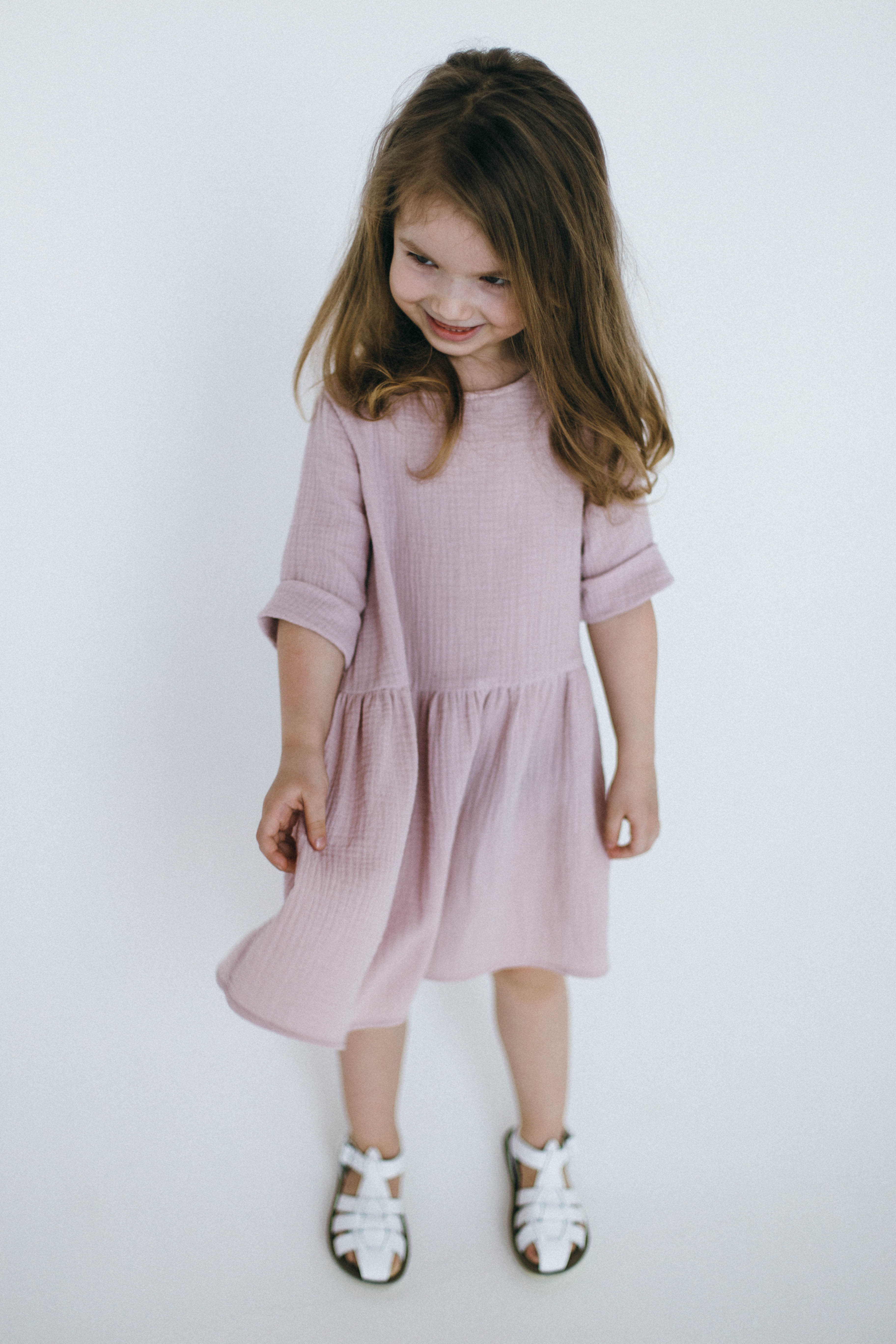Beautifully handcraft our Back to Nature soft pink girls dress with 3/4 sleeves for cooler weather from organic cotton to bring you closer to nature with the freedom it gives you. This product is made of 100% organic cotton (GOTS).  This sustainable girls' dress is comfortable and soft. Mommy and Me styles are available.