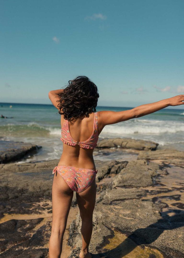 Louise Misha Kauai recycled bikini bottoms in Bohemian Strawberry — side-tie silhouette, front view