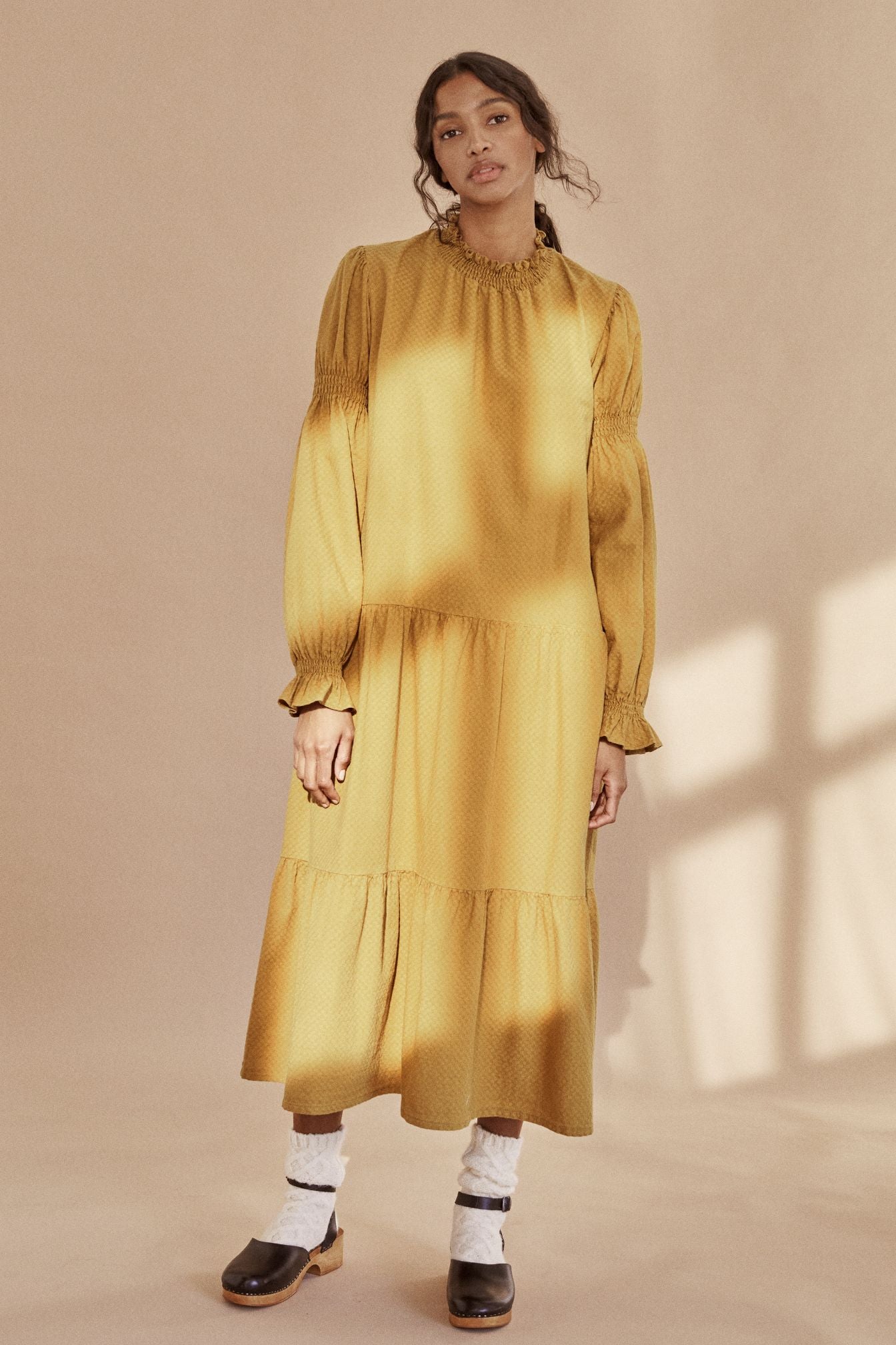 The breathable organic cotton women maxi dress online. This dress is flowy and lightweight, made with organic cotton in mustard colour by The New Society. The women midi dress is trendy and comfortable.